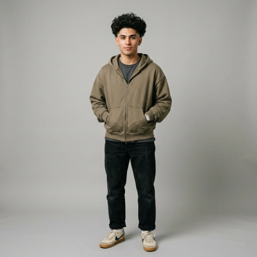 A 21-year-old man with a Fluffy Edgar haircut wearing an oversized zip-up hoodie and relaxed jeans.
