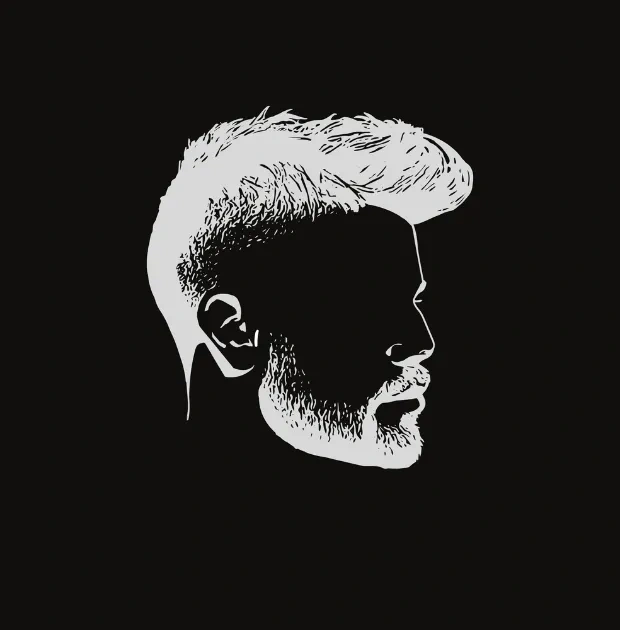 Modern Edgar haircut with textured top and fade on a black background